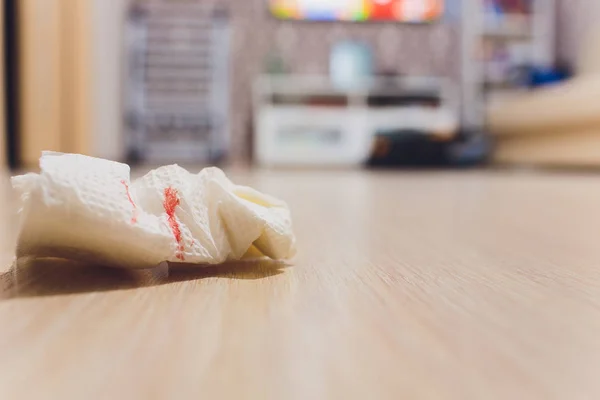 Blood of woman with period, Period of woman, Menstrual blood on sanitary pad and wooden background.