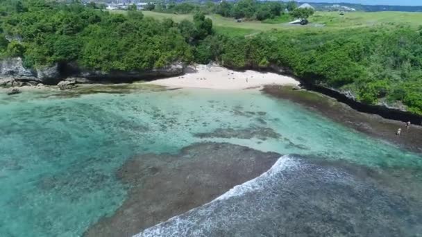 Top view aerial photo from flying drone seats Kuta beach Bali — Stock Video