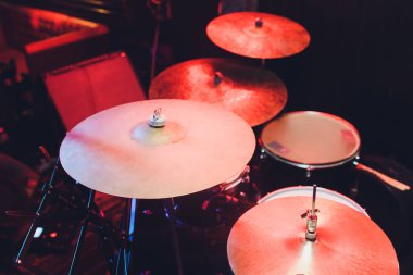 Modern drum set shot in smoky dark studio. clipart