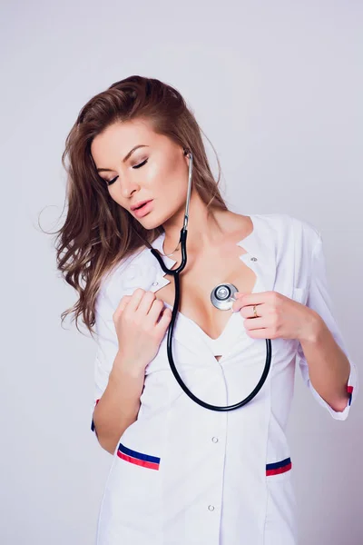 Young doctor woman smile face with stethoscope and white coat — Stock Photo, Image