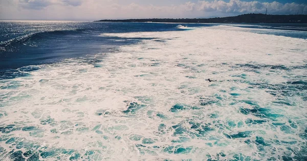 Aerial view surfers and wave in tropical ocean. Top view — Stock Photo, Image