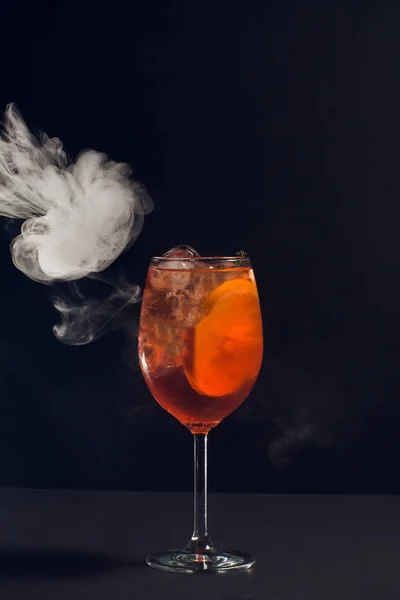 Beautiful cocktail isolated with dry ice smoke.