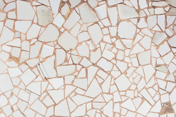 Broken tiles white pattern wall texture background.