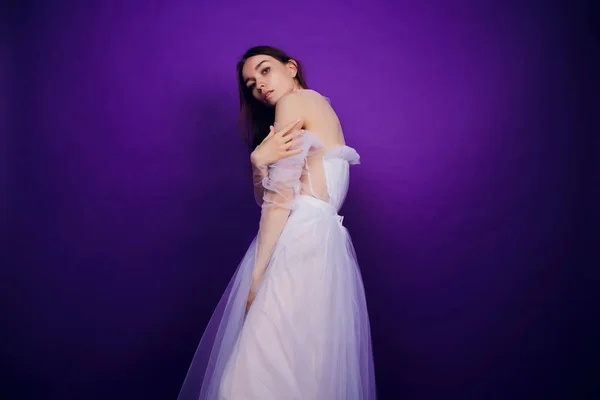 Fashion portrait young elegant girl in white dress. Black background, studio shot. Beautiful woman with red and blue. girl in neon. — Stock Photo, Image