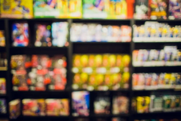 Livros em quadrinhos na estante para a loja de fundo . — Fotografia de Stock