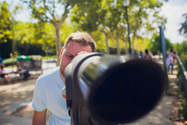 young man Binocular against observation deck view.