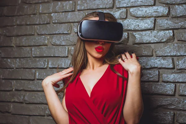 Girl in red dress virtual glasses vr. — Stock Photo, Image