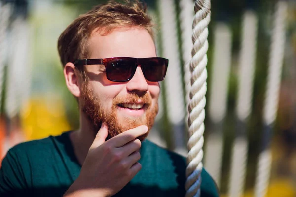 Adult man in playground. man with beard and glasses. stylish modern young — Stock Photo, Image