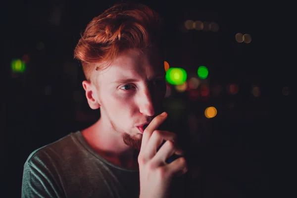 Portrait mature man smoking electronic cigarette in the streets at night — Stock Photo, Image