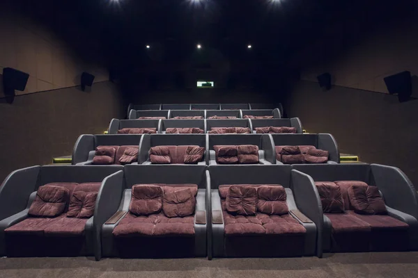 Empty silver cinema room interior with white screen and seats — Stock Photo, Image