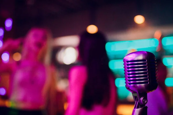 microphone on stand up comedy stage with reflectors ray, high contrast image