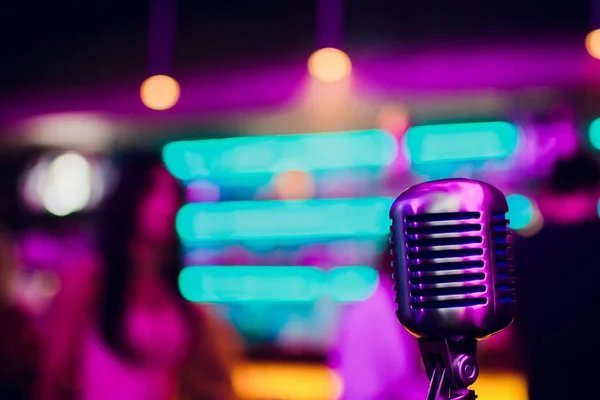 microphone on stand up comedy stage with reflectors ray, high contrast image