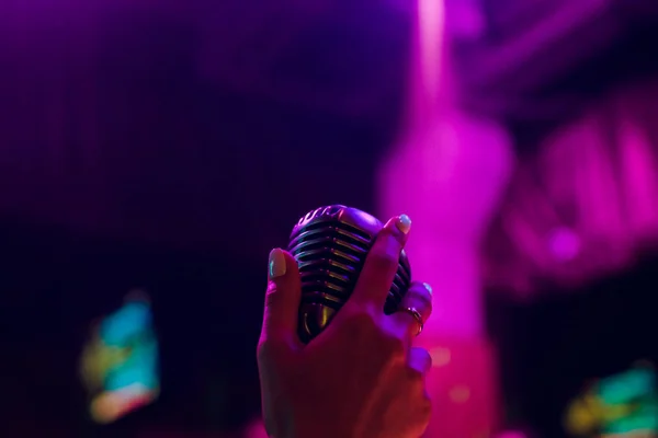 microphone on stand up comedy stage with reflectors ray, high contrast image