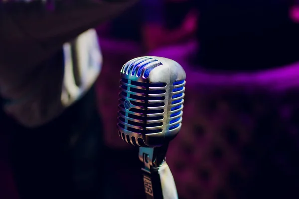 microphone on stand up comedy stage with reflectors ray, high contrast image