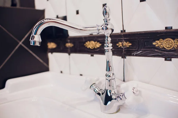 Copper faucet mixer with porcelain handles, stylized antique, shower in the bathroom.