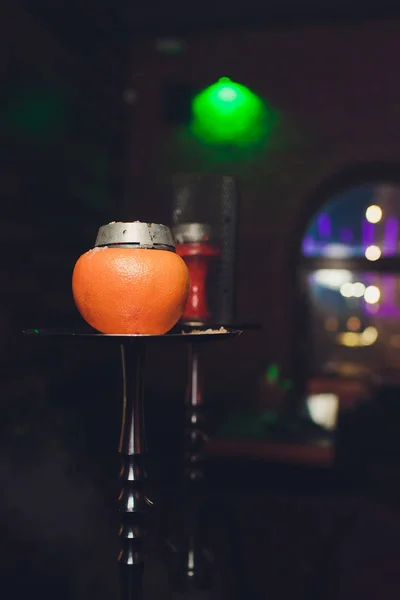 Luxury hookah with orange. Exotic bowl with fruit. Hookah lounge. Fruits and coals. Glamours relax. Narghile and water pipe. — Stock Photo, Image