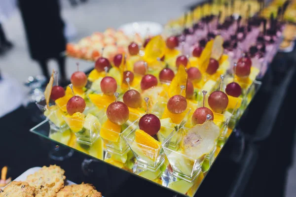 Buffet table - a lot of canapes and sandwiches, shallow DOF. — Stock Photo, Image