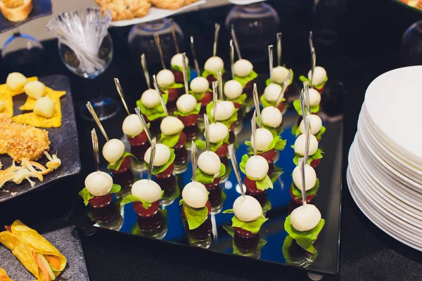 Buffet table - a lot of canapes and sandwiches, shallow DOF. — Stock Photo, Image