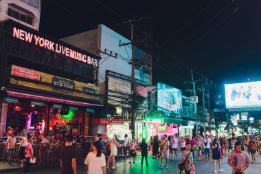 PHUKET, THAILAND - February 28, 2019: Infamous Bangla Walking Street near the beautiful tropical beach on Phuket Island, Thailand. Night time. clipart