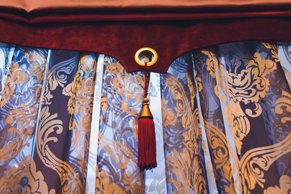 Holder for room curtains. Fragment photo curtain, interior detail, curtain detail close up.