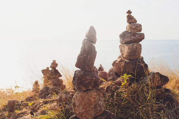 Stack tower stone zen art folded blurred rock background. large small ascending stone cobblestone tower. — Stock Photo, Image