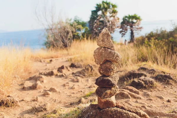 Stack tower stone zen art folded blurred rock background. large small ascending stone cobblestone tower. — Stock Photo, Image