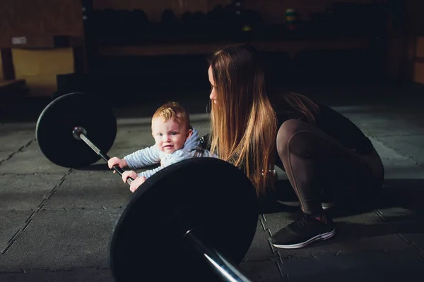 Woman as a therapist at physiotherapy and sports with child in gym. — Stock Photo, Image