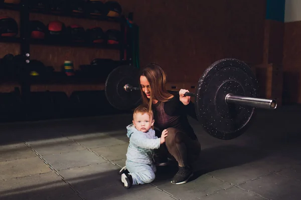 Woman as a therapist at physiotherapy and sports with child in gym. — Stock Photo, Image