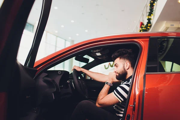 First test drive. Handsome young man ready to make first test drive.