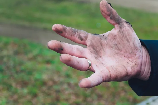 Dirty hand. Dirty hand of man on sand.