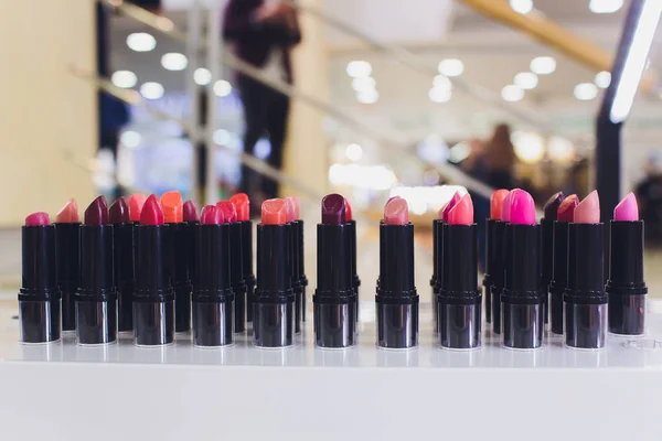 Lipsticks on counter background. High quality lipstick. Daily make up. Cosmetics artistry. Lipstick for professional make up. Pick color which suits you. Compare makeup products. Lip care concept.
