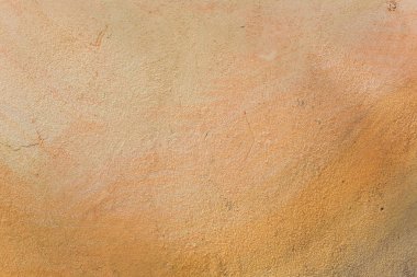 Sarı grunge beton duvar, desenli arka plan.