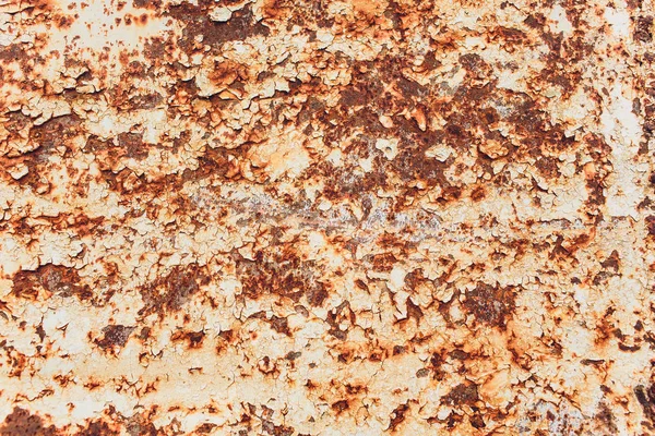 Rusted white painted metal wall. Rusty metal background with streaks of rust. Rust stains. The metal surface rusted spots.metal rust texture background.