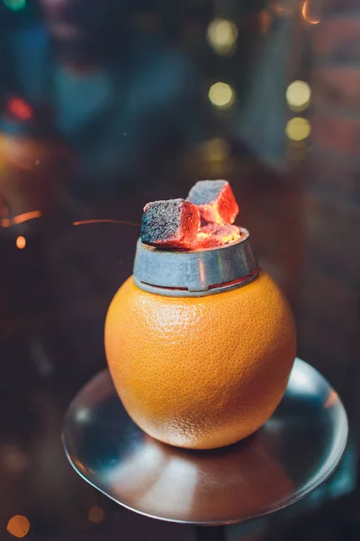 Stylish hookah with aroma grapefruit for relax. grapefruit shisha. Hookah lounge.