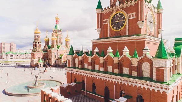 Yoshkar-Ola city, Republic of Mari El, Russia - May, 2019: View of the Cathedral of the Annunciation of the Blessed Virgin Mary with a monument.