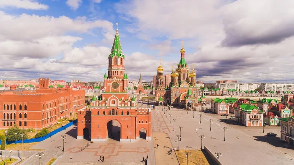 Yoshkar-Ola city, Republic of Mari El, Russia - May, 2019: View of the Cathedral of the Annunciation of the Blessed Virgin Mary with a monument.