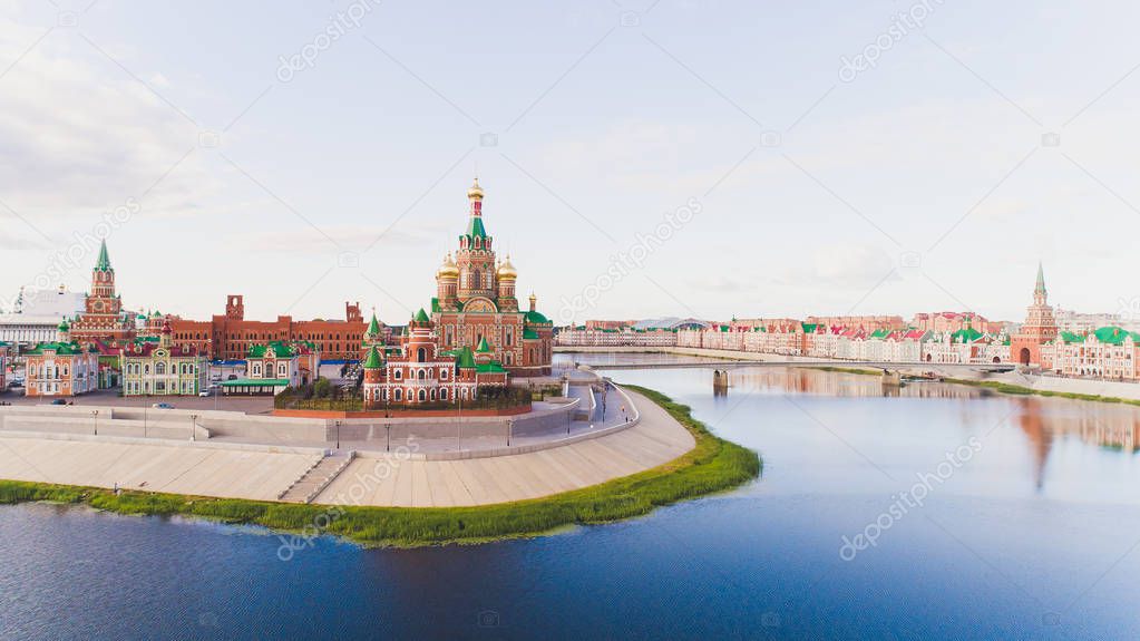 View of the Cathedral of the Annunciation of the Blessed Virgin Mary with a monument Yoshkar Ola city. Mari El, Russia.