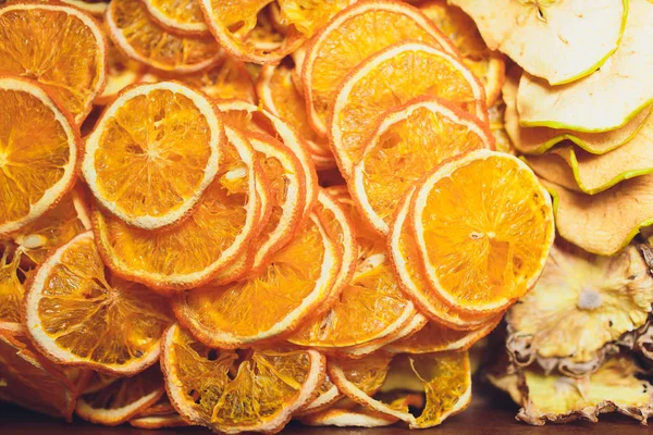 slices of dried citrus fruits. Grapefruit, lime, orange, lemon. Dehydrated fruits for decorating dishes for drinks, desserts and cocktails. Top view. Wonderful background.