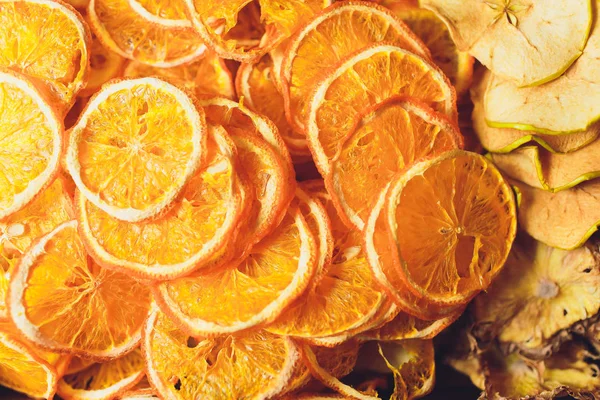 slices of dried citrus fruits. Grapefruit, lime, orange, lemon. Dehydrated fruits for decorating dishes for drinks, desserts and cocktails. Top view. Wonderful background.