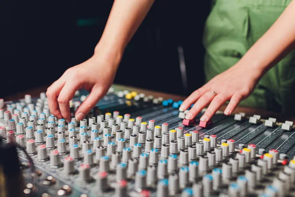 the mixer. remote for sound recording. sound engineer at work in the studio. sound amplifier mixing console equalizer. record songs and vocals. mixing tracks. audio equipment. work with musicians. DJ.