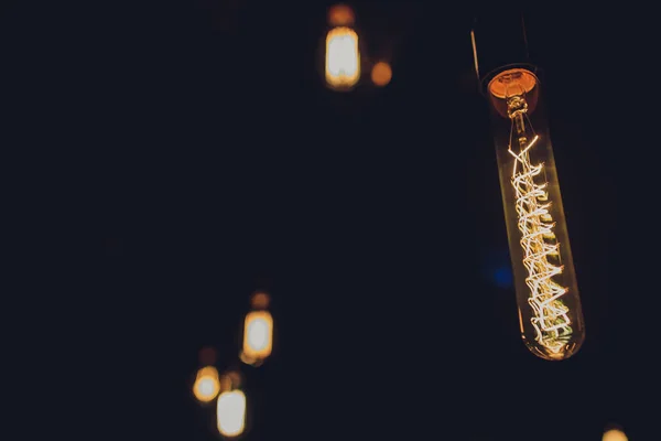 Lighting decor. Retro light bulb filament close up.Illuminated. — Stock Photo, Image