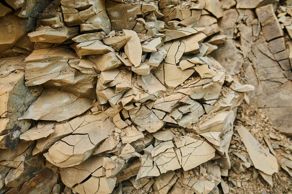 Layers of soil with groundwater. Details of earth layers in a clay pit. Form and colors of soil. Background natural textures. Ground land cross section. Abstract terrain view. Cracked dry rural ground — Stock Photo, Image