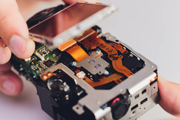 Repairing digital single lens reflex camera, isolated.