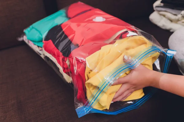 Space saver saving seal bag sucking air out , vacuum clothing storage compressed package. — Stock Photo, Image