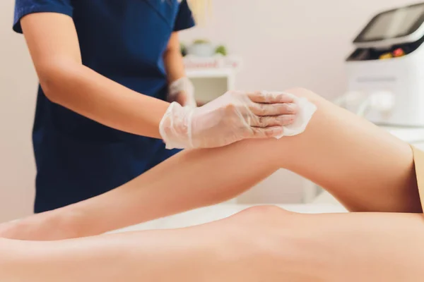 Beautician Giving Epilation Laser Treatment To Woman On Thigh.