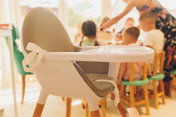 White dining chair for children. That has food stands Suitable for young children To make Baby a personal space to dine Diet training.
