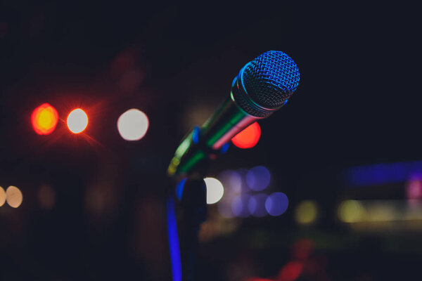 Close up of microphone in concert hall or conference room.