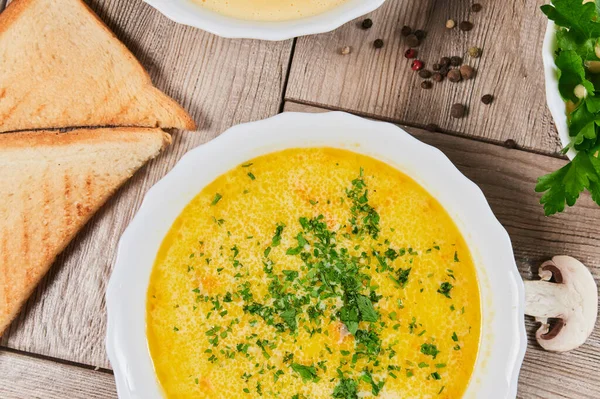 Different kinds of soups - pumpkin soup, cheese cream-soup and mushroom cream-soup on the table. — Stock Image Different kinds of soups - pumpkin soup, cheese cream-soup and mushroom cream-soup on the table. Royalty Free Stock Photos
