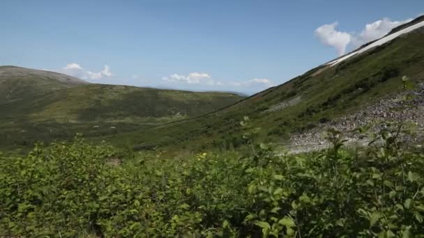 Green forest among the red mountains in the Magadan region. time-lapse — Stock Video