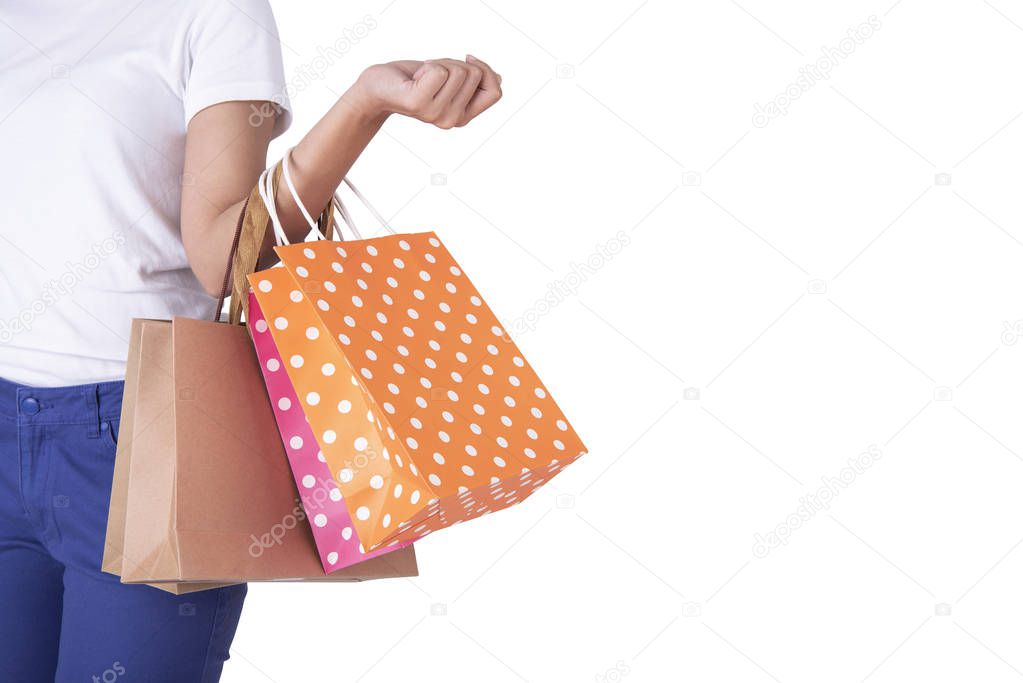 asian girl wearing dress and holding shopping bags with copy space isolated on white background.